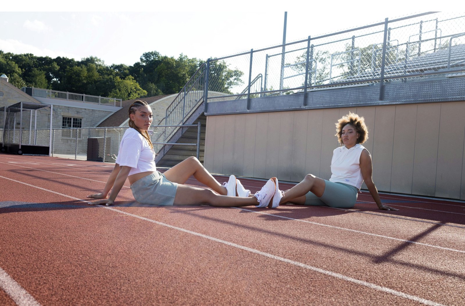 a couple of women on a track