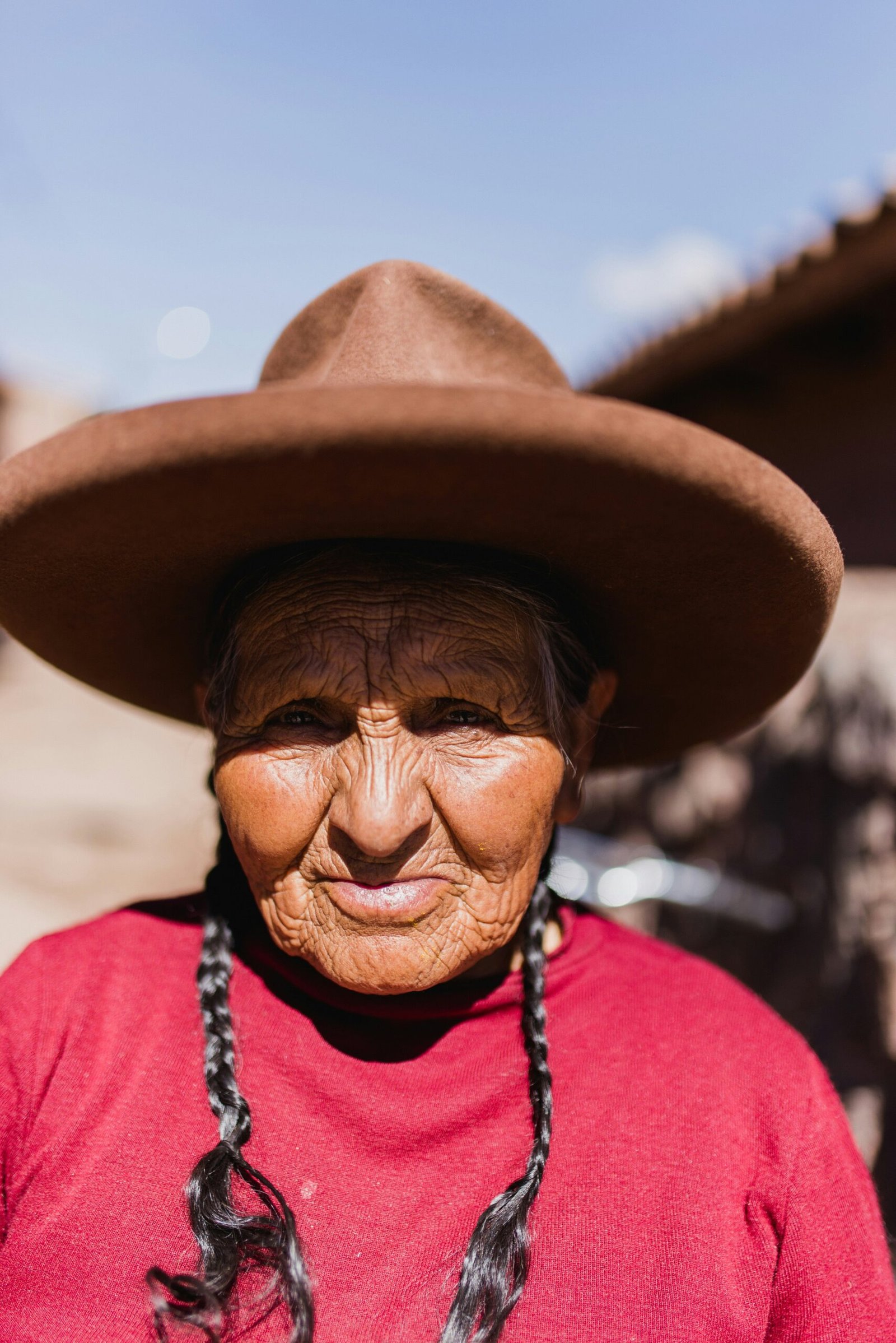 selective focus photo of woman wearing brown hat during daytime